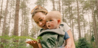 Newborn baby peacefully sleeping in a crib with soft lighting, symbolizing gentle bedtime techniques for better rest.